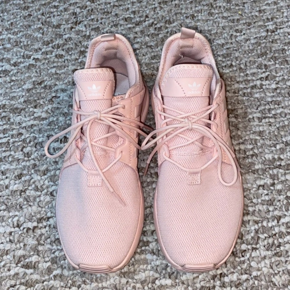 Adidas sneakers fits a women’s size 7 foot
